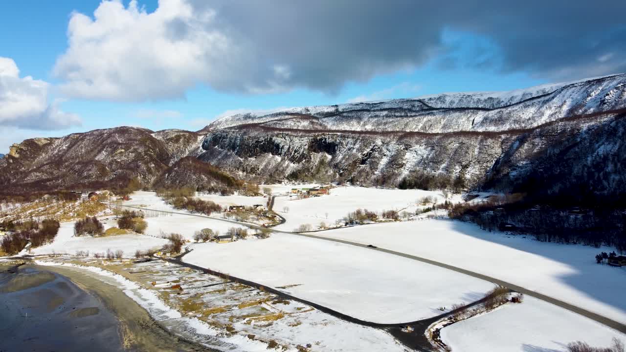 This 4K drone video showcases the snowy landscapes of Bodø, Norway. Perfect for winter-themed projects, it features frozen fjords, mountains, and serene Arctic beauty