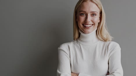 smiling woman in white turtleneck