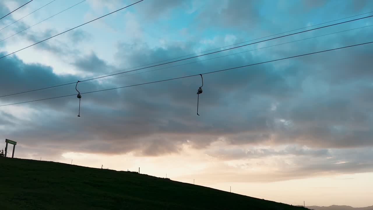 beautiful sunset or sunrise in the mountains in summer with ski lift
