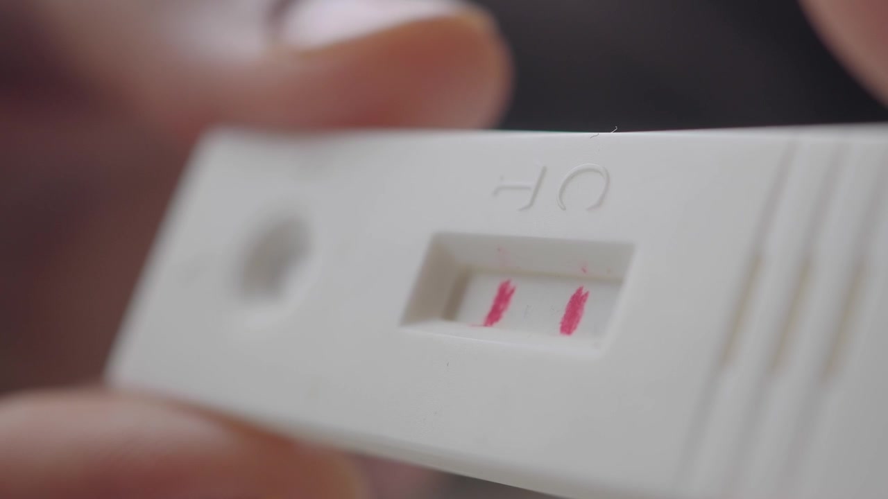 Close-up of a Positive Pregnancy Test Showing Two Lines
