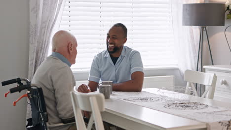 caregiver and elderly man at table