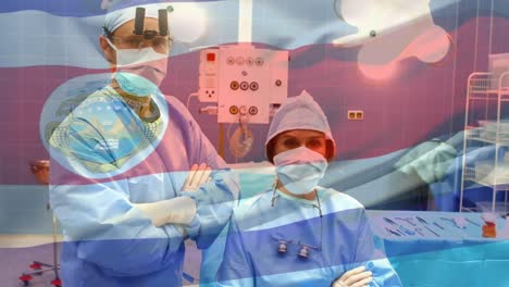 Animation-of-flag-of-costa-rica-waving-over-surgeons-in-operating-theatre