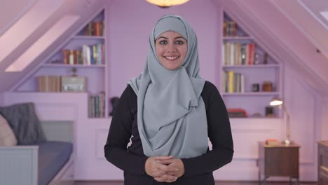 happy muslim woman smiling on camera
