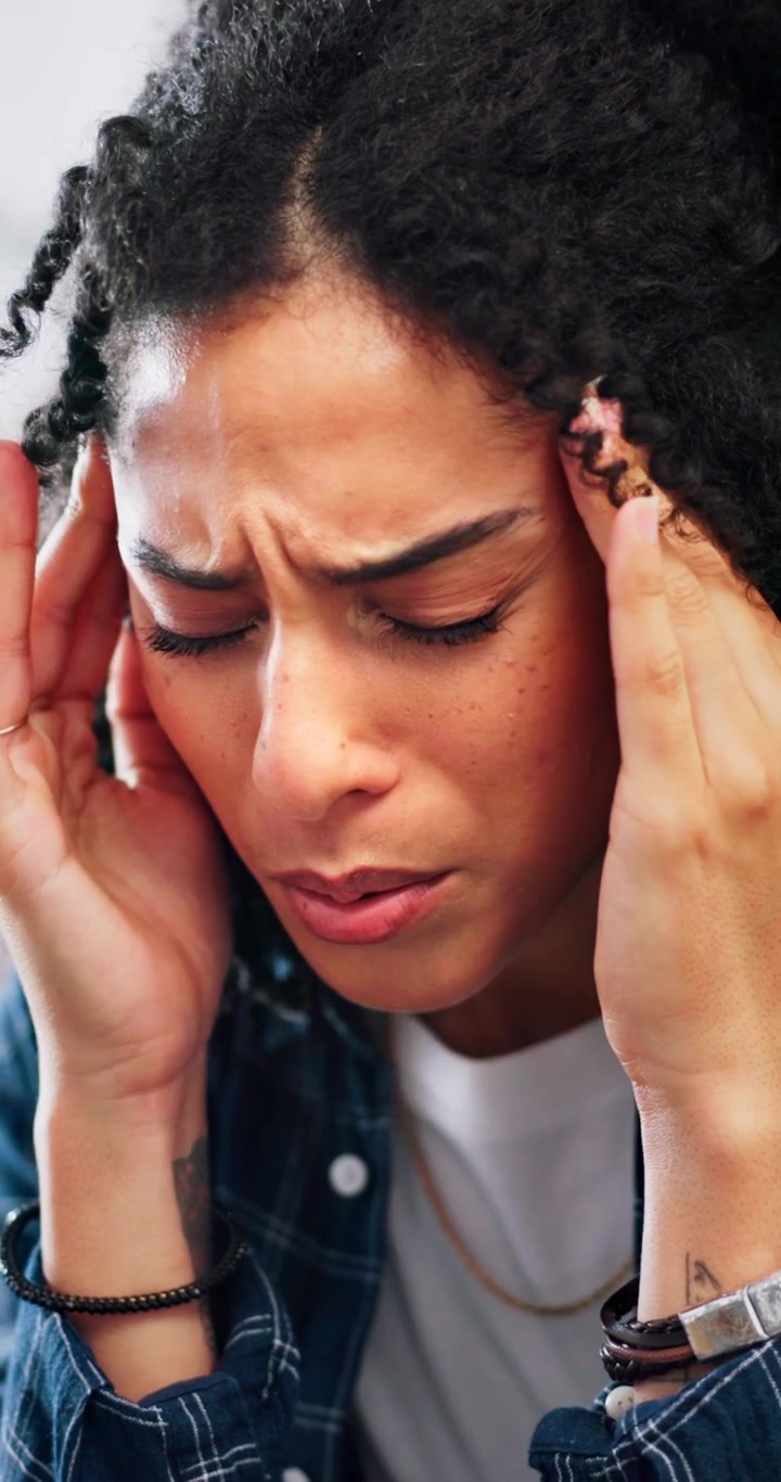 Young Woman Suffering From a Severe Headache