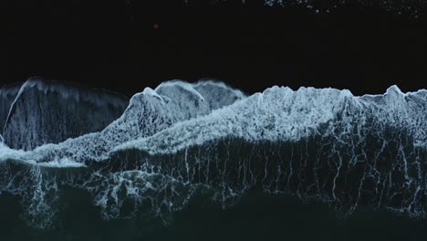 Beautiful-Atlantic-waves-rolling-on-the-black-beach--top-view