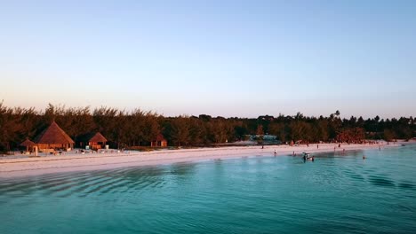 Unbelievable-panorama-curve-flight-drone-shot-at-sunset-beach-in-paradise