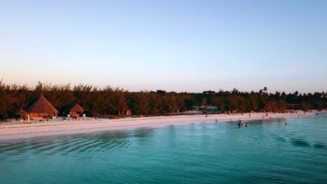 unbelievable panorama curve flight drone shot at sunset beach in paradise