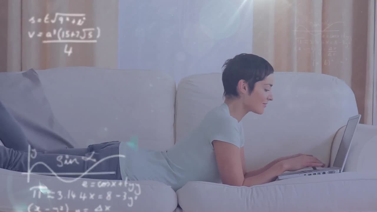 Animation of mathematical equations against caucasian woman using a laptop lying on the couch