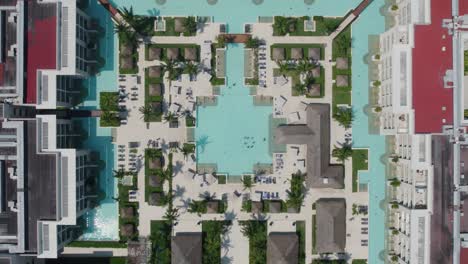 lowering aerial view of a large pool system at paradisus playa del carmen in mexico