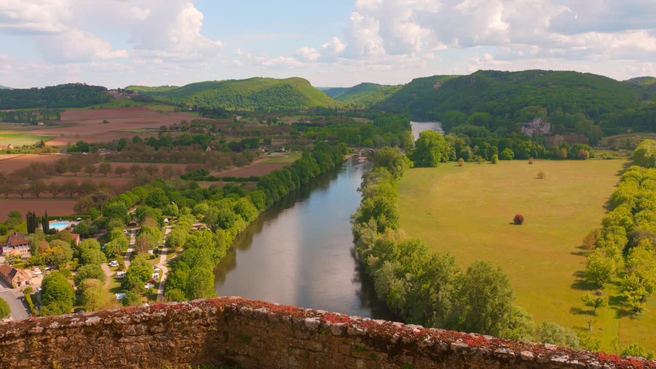 A breathtaking panoramic view from the historic Beynac Castle showcases the stunning Dordogne valley, capturing the essence of one of France's most officially beautiful villages