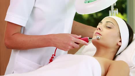 pretty brunette getting micro dermabrasion treatment