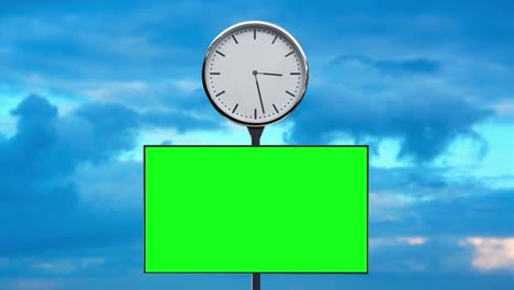 clock and screen with chromakey on pole against clouds
