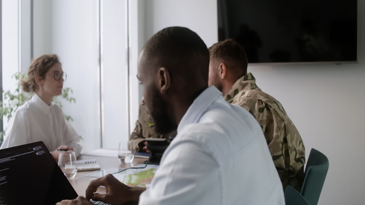 Meeting in a military office