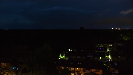 Time-lapse-sequence-of-thunderstorm-lightning-at-night-over-a-village