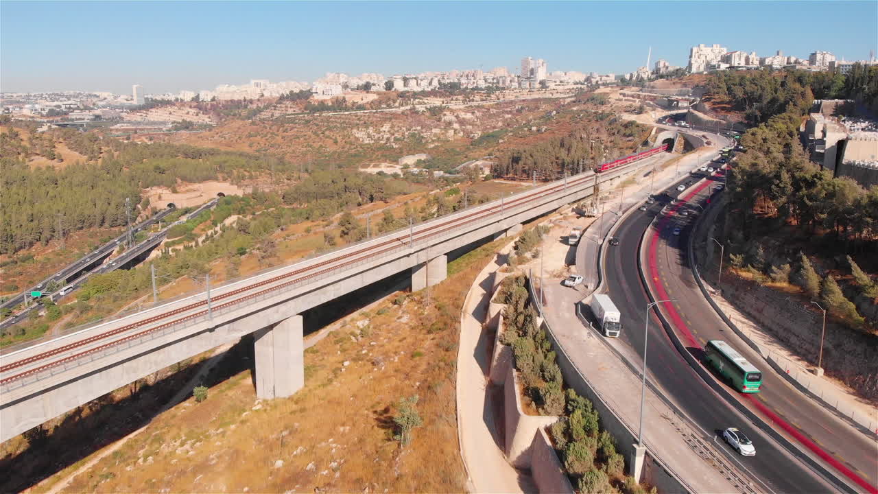 Train on large bridge aerial, Jerusalem entrance