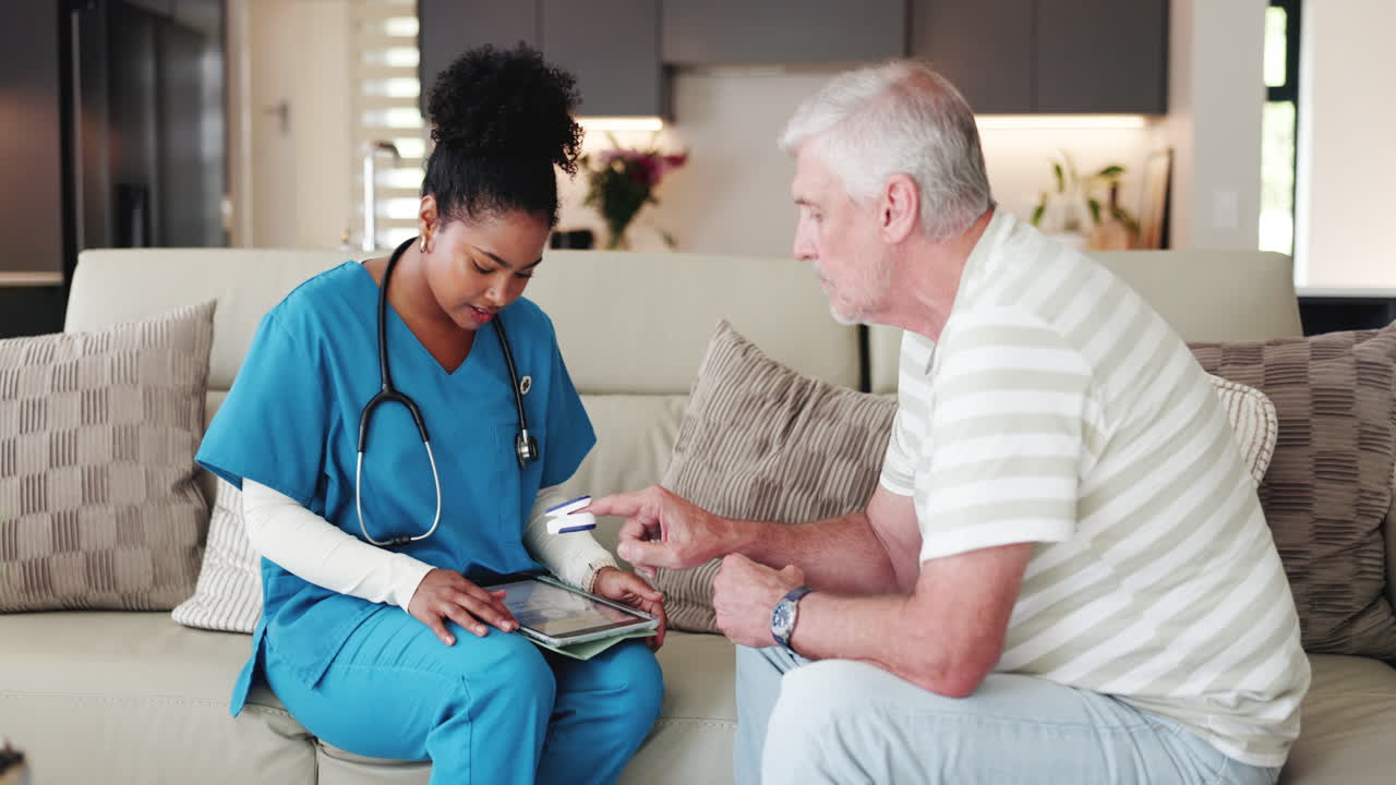 Nurse Checking Senior Man's Oxygen Levels During Home Visit