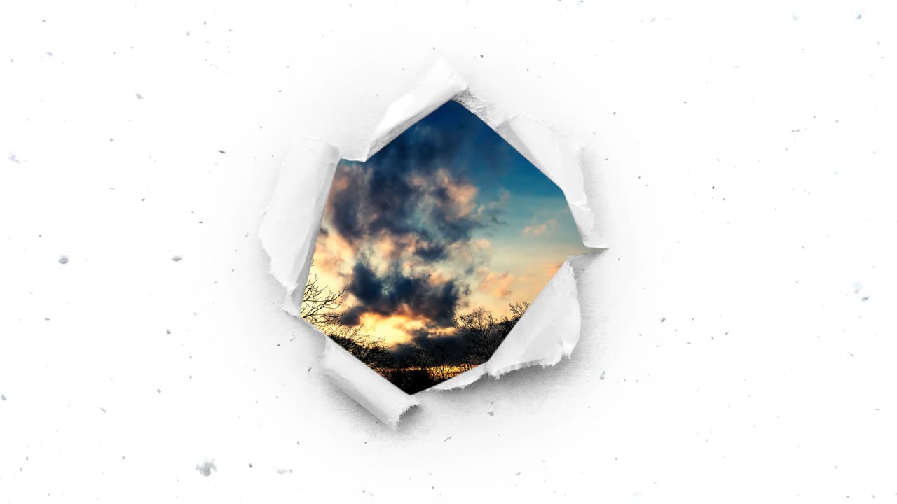 A hole with torn edges in the snowy sky through which you can see the beautiful summer sky at sunset.