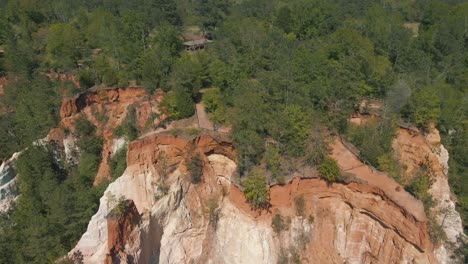 epic drone footage of a cliff overlooking an enormous canyon below