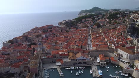 Drone-video-flying-over-the-top-of-the-city-of-Dubrovnik-detailing-the-roof-tops-and-make-up-of-the-city