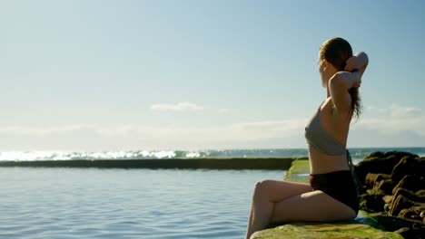 woman relaxing in the pool at beach 4k