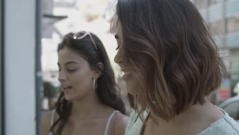 closeup view of pretty woman standing on street and talking