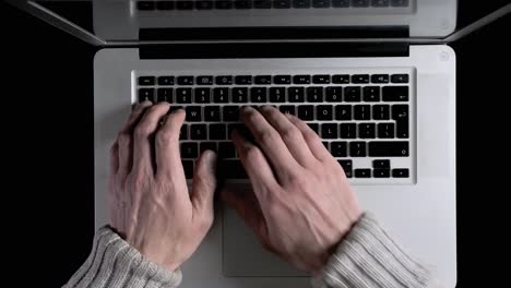 a man working on a laptop online from his home