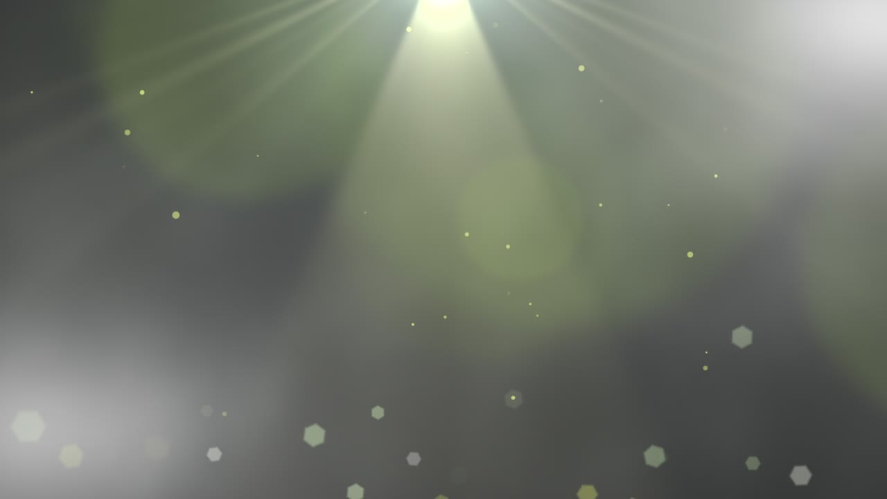 어두운 배경에서 날아가는 작은 입자 및 광선