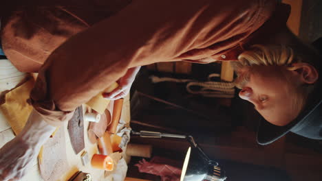 man working with leather in workshop