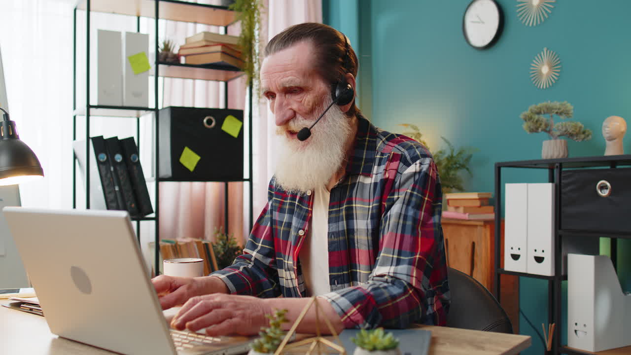 Senior businessman wearing headset freelance worker call center or support service operator helpline