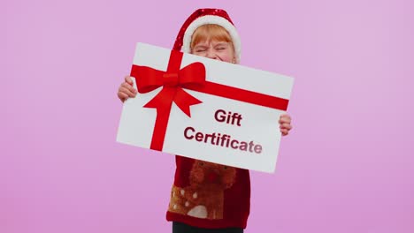 Funny-girl-wears-Christmas-Santa-hat-and-hat-presenting-card-gift-certificate-coupon-winner-voucher