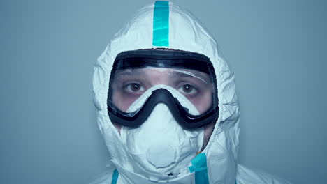 static shot of hospital worker face with mask and goggles covid-19 protective gear