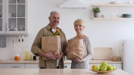 happy couple with grocery bags