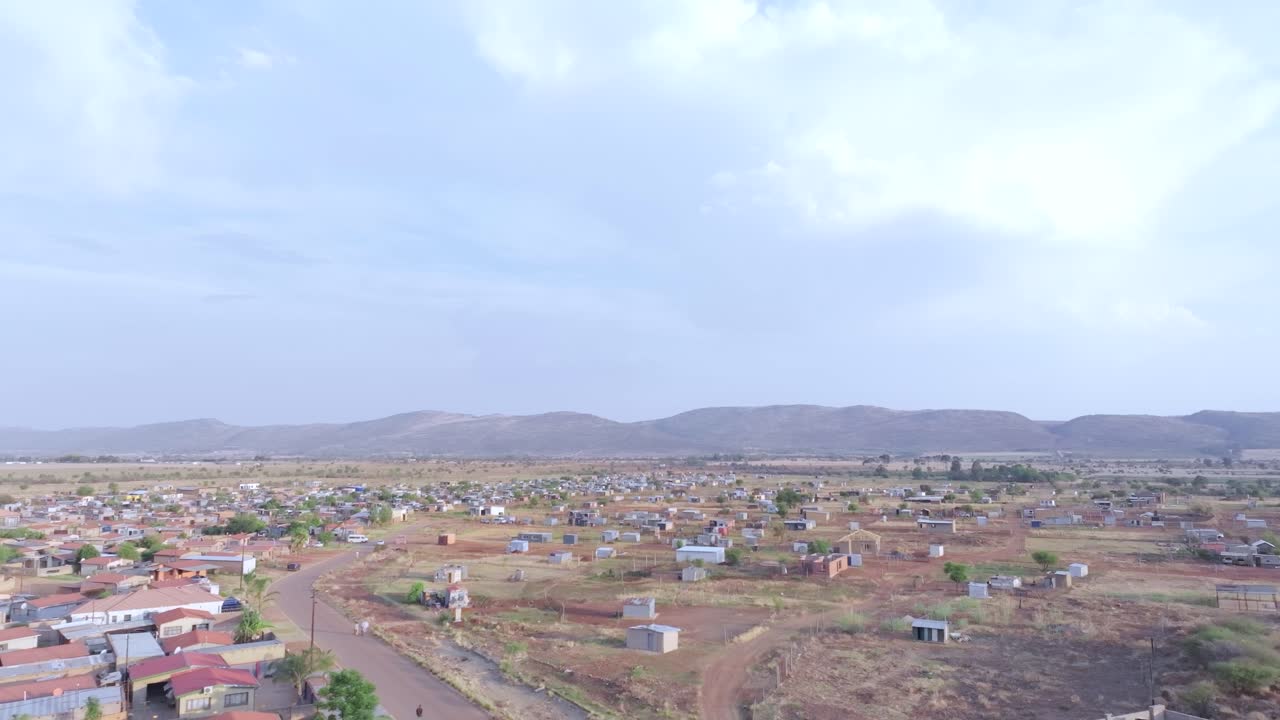 Mall of africa township in midrand, showing vast dry land and homes, aerial view