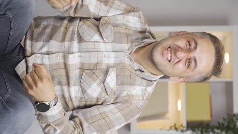 Vertical-video-of-Man-giving-greeting-and-applause-to-camera.