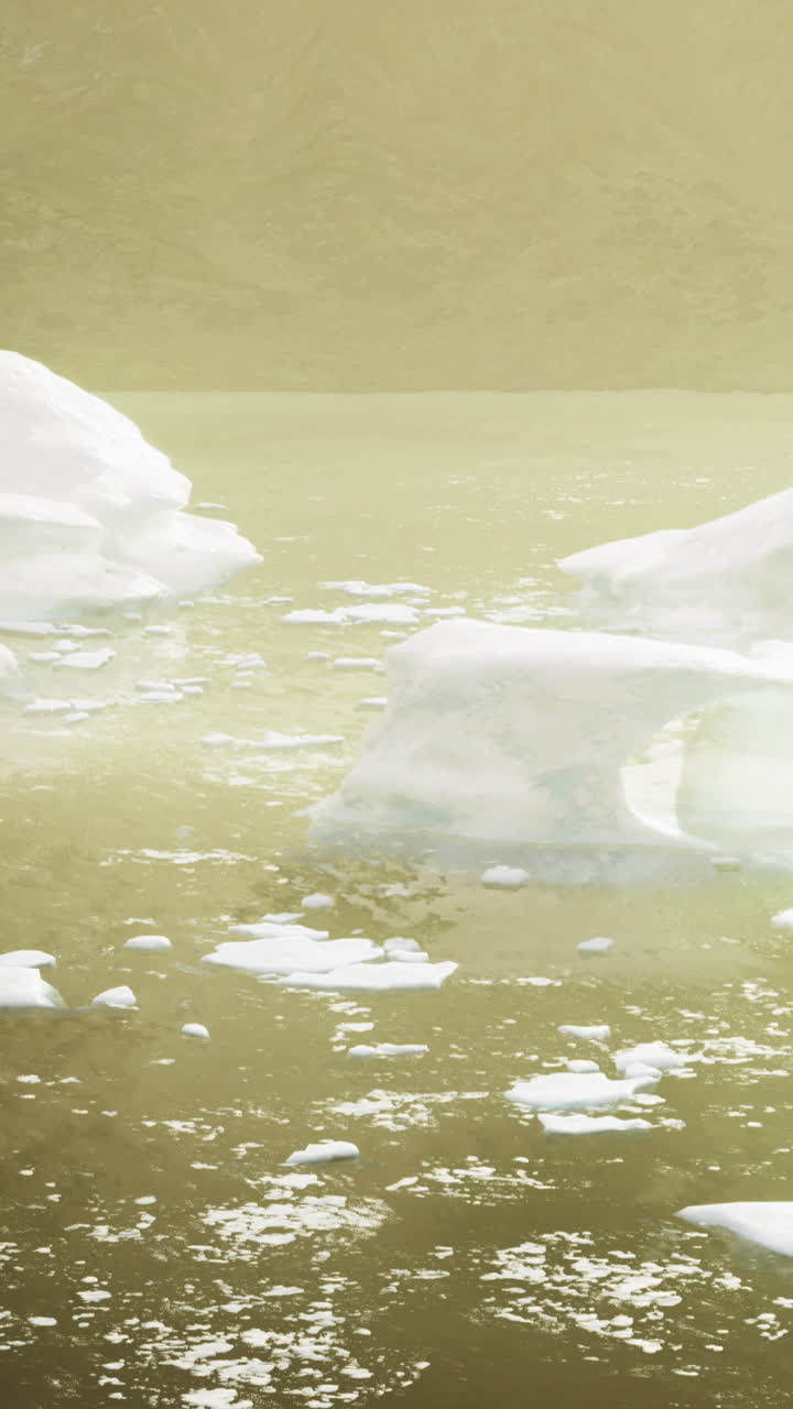 Glacial landscape with ice formations in tranquil water at sunset