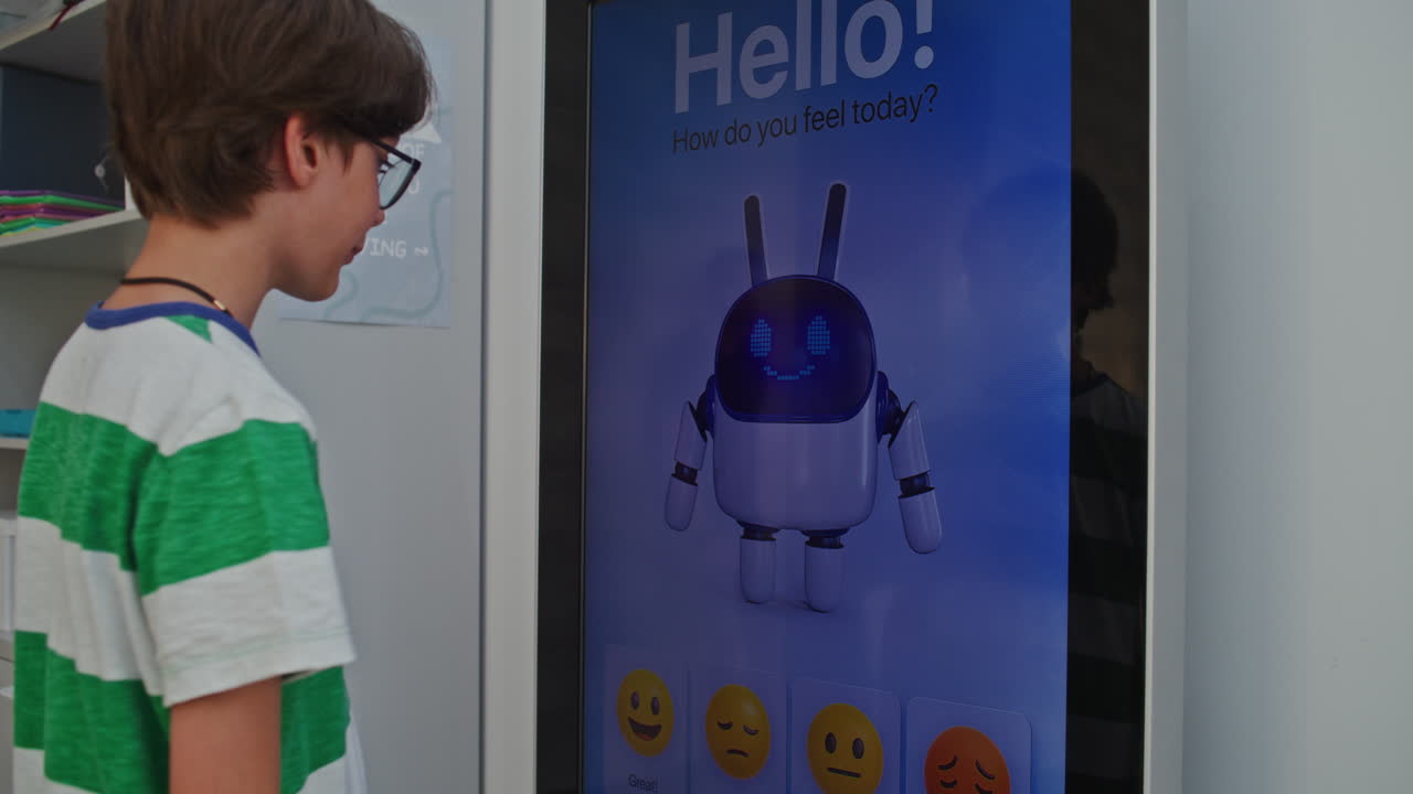 Boy Interacting with Interactive Robot Screen