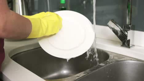 woman washing up the dishes