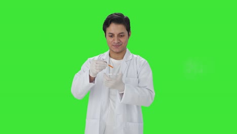 Happy-Indian-scientist-doing-scientific-experiments-Green-screen