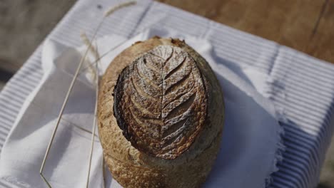 lovely curved sourdough bread on a wooden table