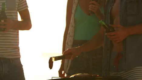 smiling friends having barbecue