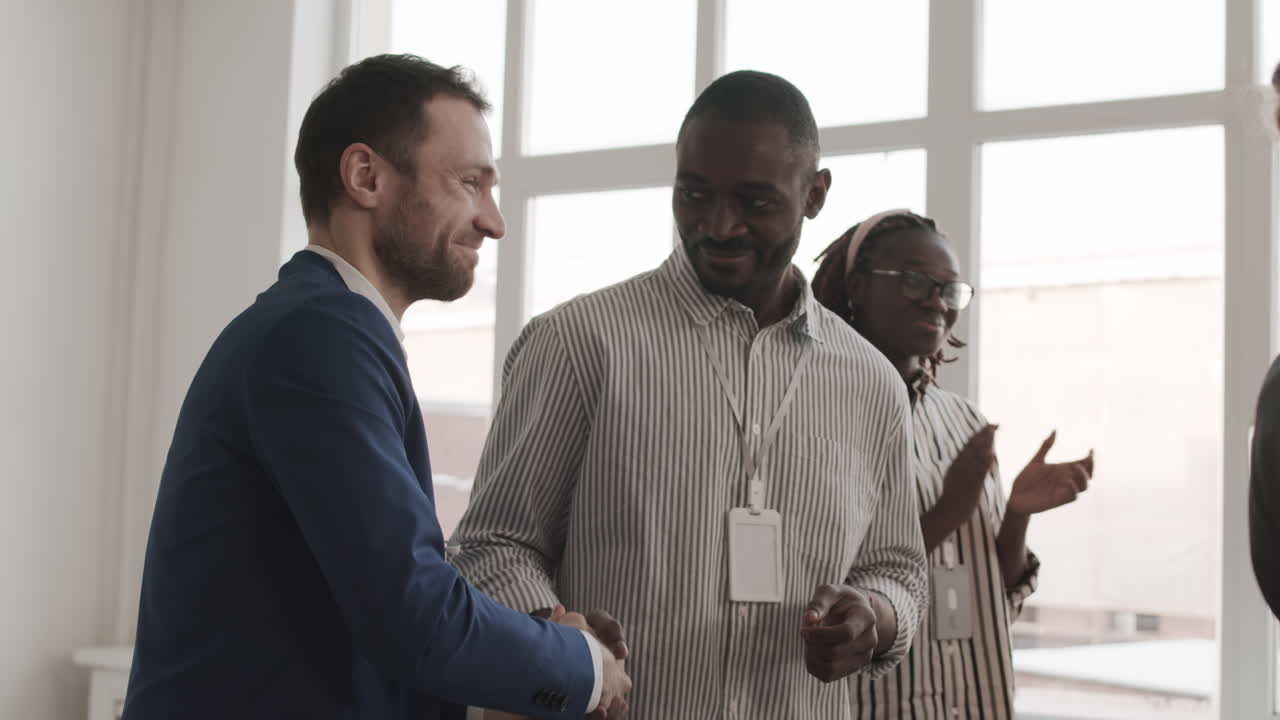Diverse Colleagues Clapping and Shaking Hands