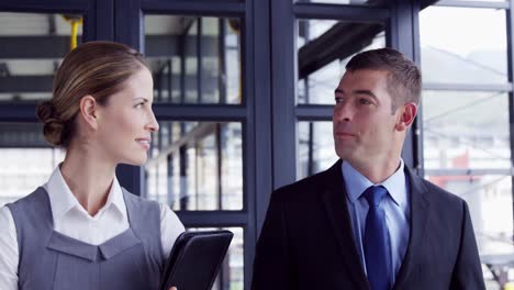 businessman and businesswoman walking together