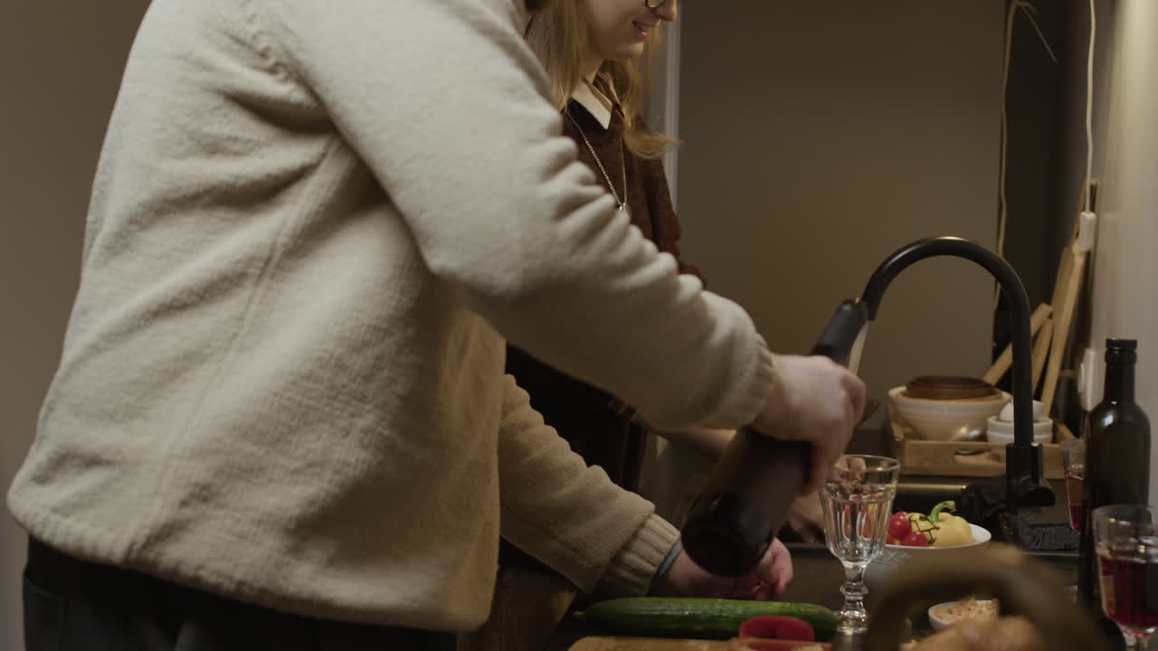 People preparing food in the kitchen
