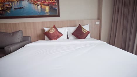 4k footage of a large queen-size bed and other accommodations at a hotel in thailand