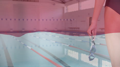 animation of flag of indonesia over caucasian female swimmer