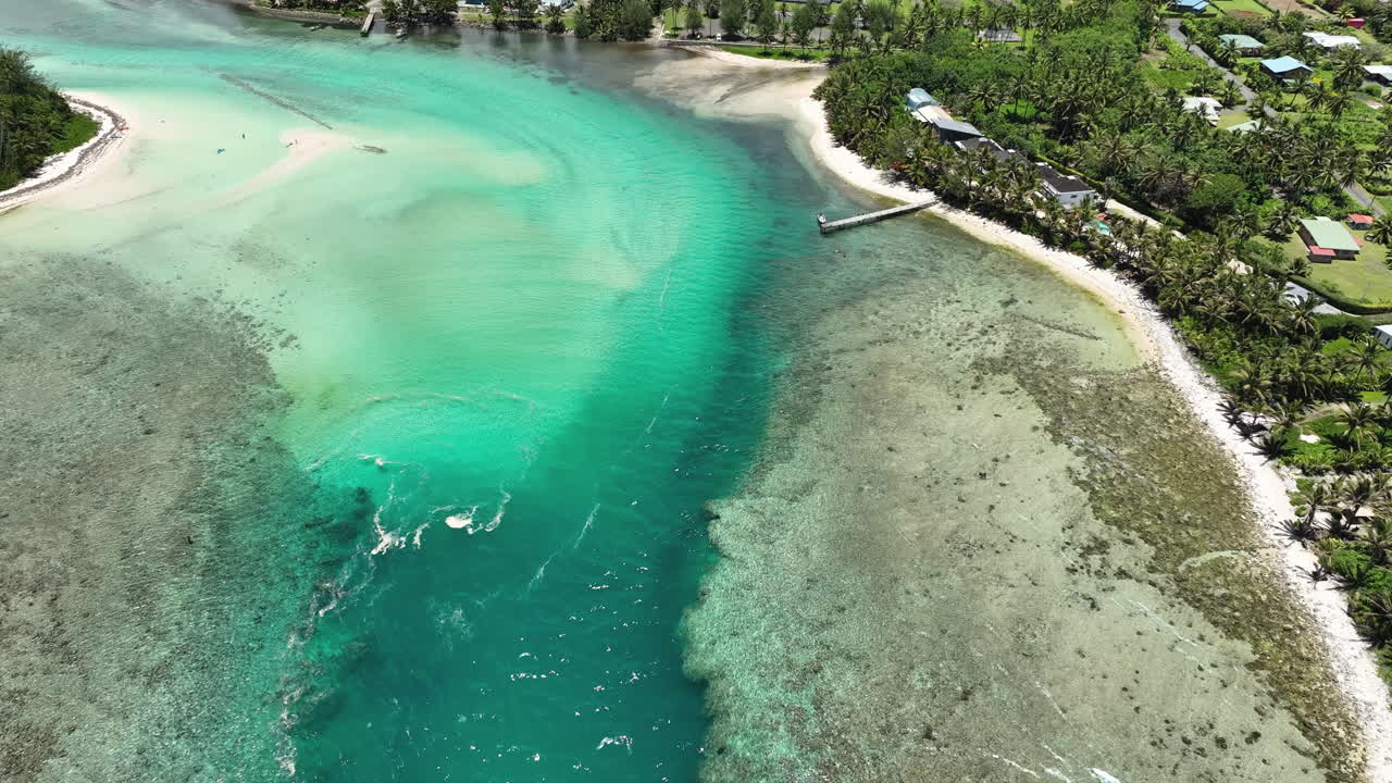 Slow aerial approach above Avana Passage following into harbor, Cook Islands Rarotonga