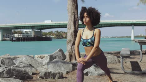 relaxed woman working out on riverside
