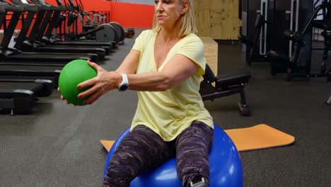 Senior-woman-doing-abs-workout-with-exercise-ball-4k