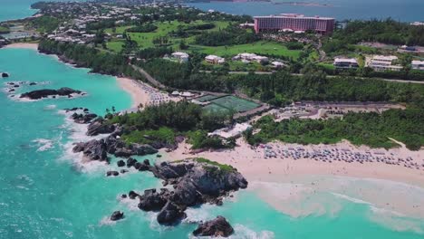 bermuda drone shot of horseshoe bay from hight above with the fairmont southampton hotel in the distance and view of the south shore