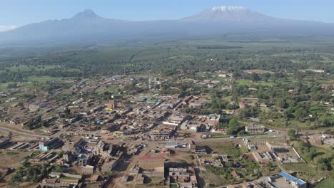 tranquil african village at by mount kilimanjaro, kenya, aerial panorama